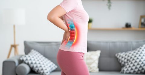 Lumbar intervertebral spine hernia, woman with back pain at home, spinal disc disease Lumbar intervertebral spine hernia, woman with back pain at home, spinal disc disease, health problems concept